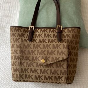 Michael Kors canvas pocketbook; front snap pocket; 3 compartments inside bag
